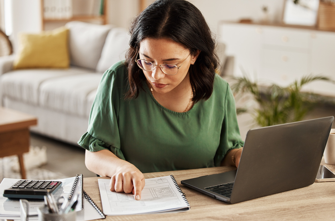 Woman reviewing employment documents and pointing at the tax-free threshold section