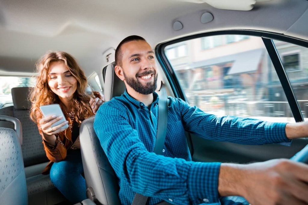 Passenger discussing Uber driver tax deductions with her driver
