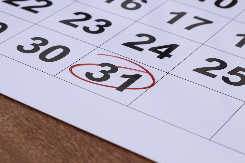 Someone circling a missed tax deadline on their calendar