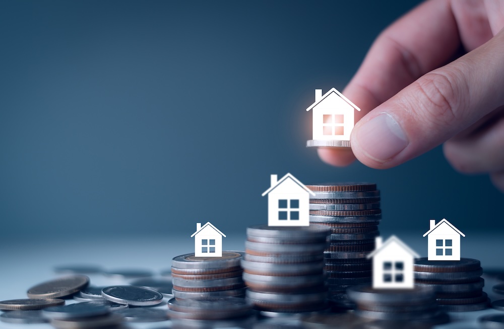 Image showing coins of decreasing value with house icons symbolising rental property value reduction